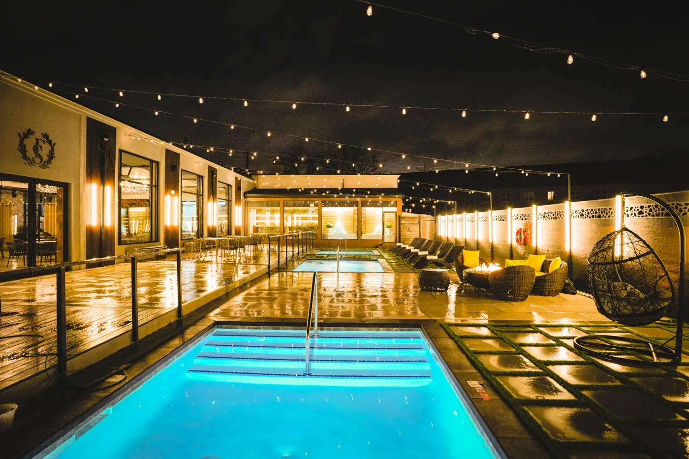 Outdoor pools at Fusion Spa & Resort with evening lighting and relaxing resort atmosphere.